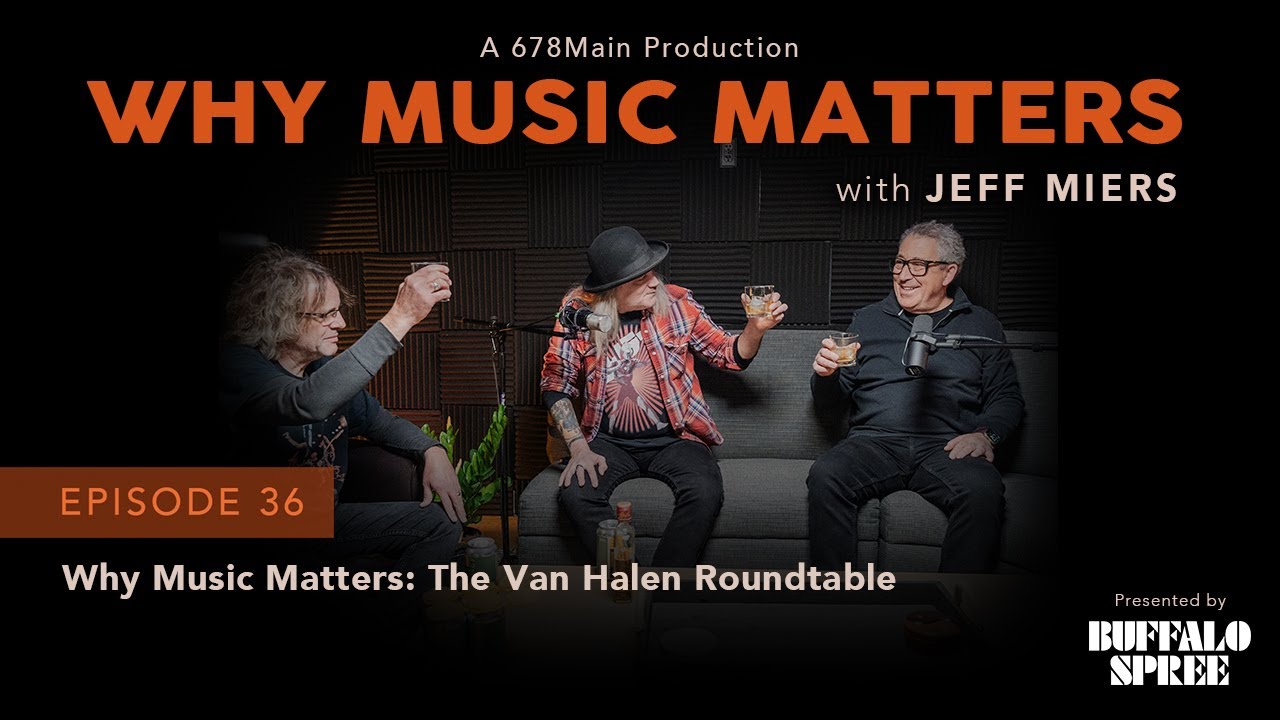 Three men seated in a studio with microphones, holding drinks, on a show poster.