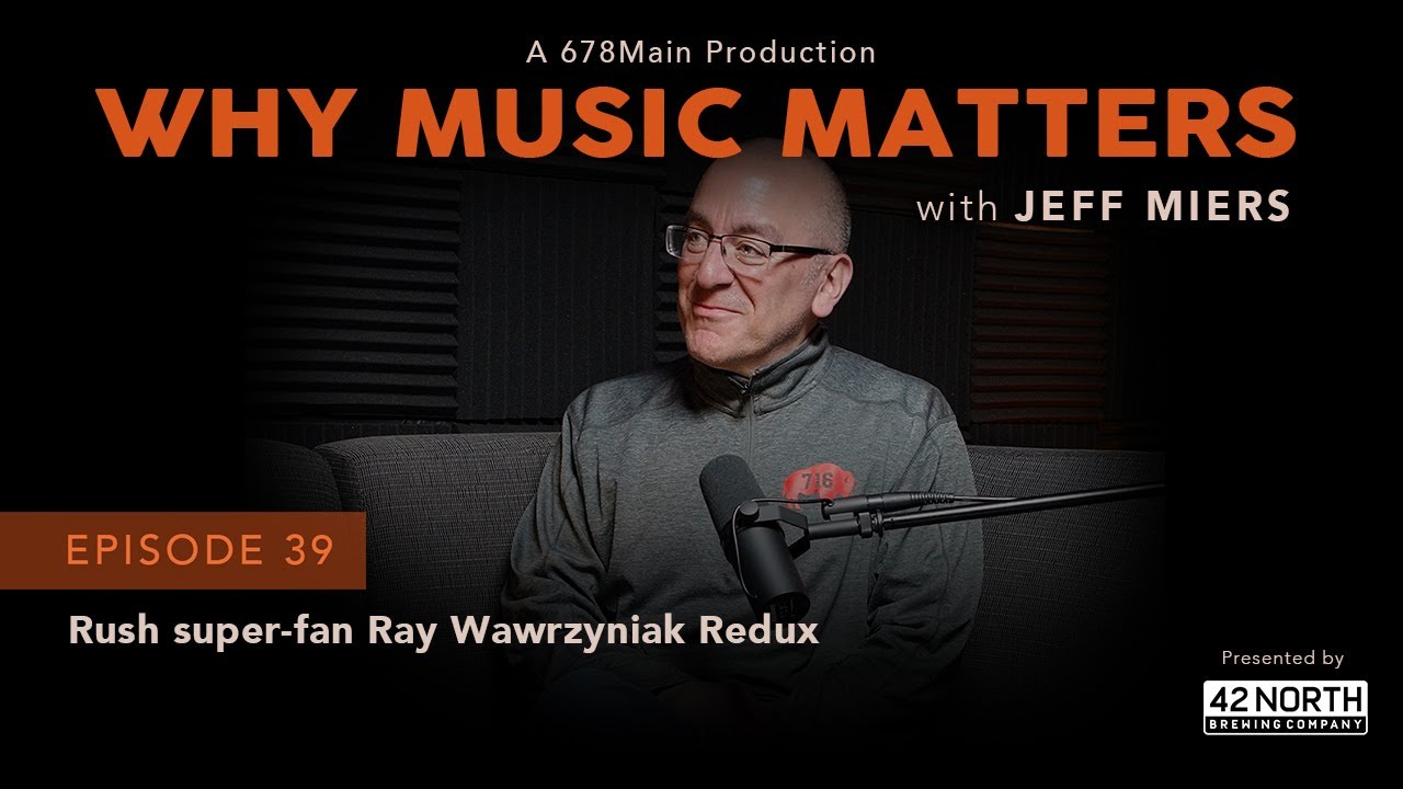 Man wearing glasses sits in a studio with a microphone under a “Why Music Matters” banner.